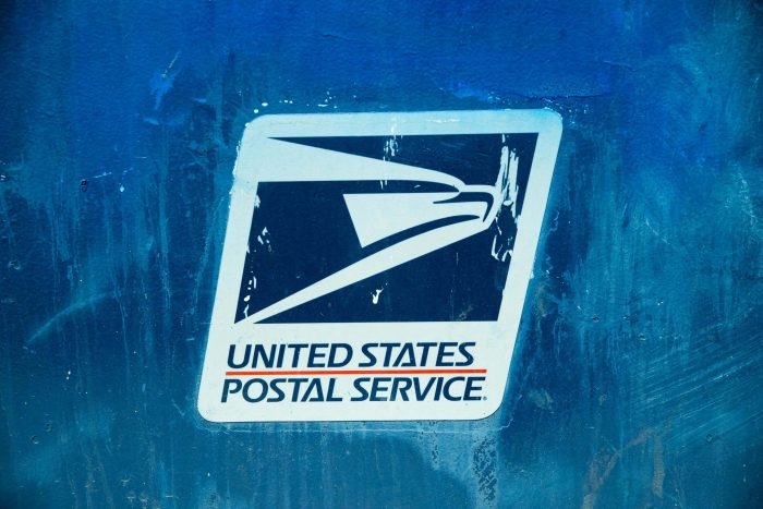 United States Postal Service (USPS) Sign on Painted Wall